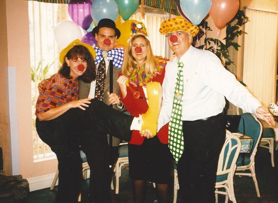 Curley & Pynn team members clown around with long-time client, Holiday Inn SunSpree Resorts Lake Buena Vista.