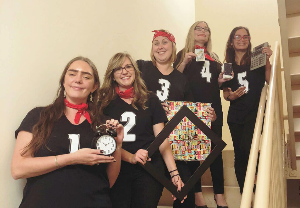 Curley & Pynn team members dress as “The Five Steps to Professional Success”