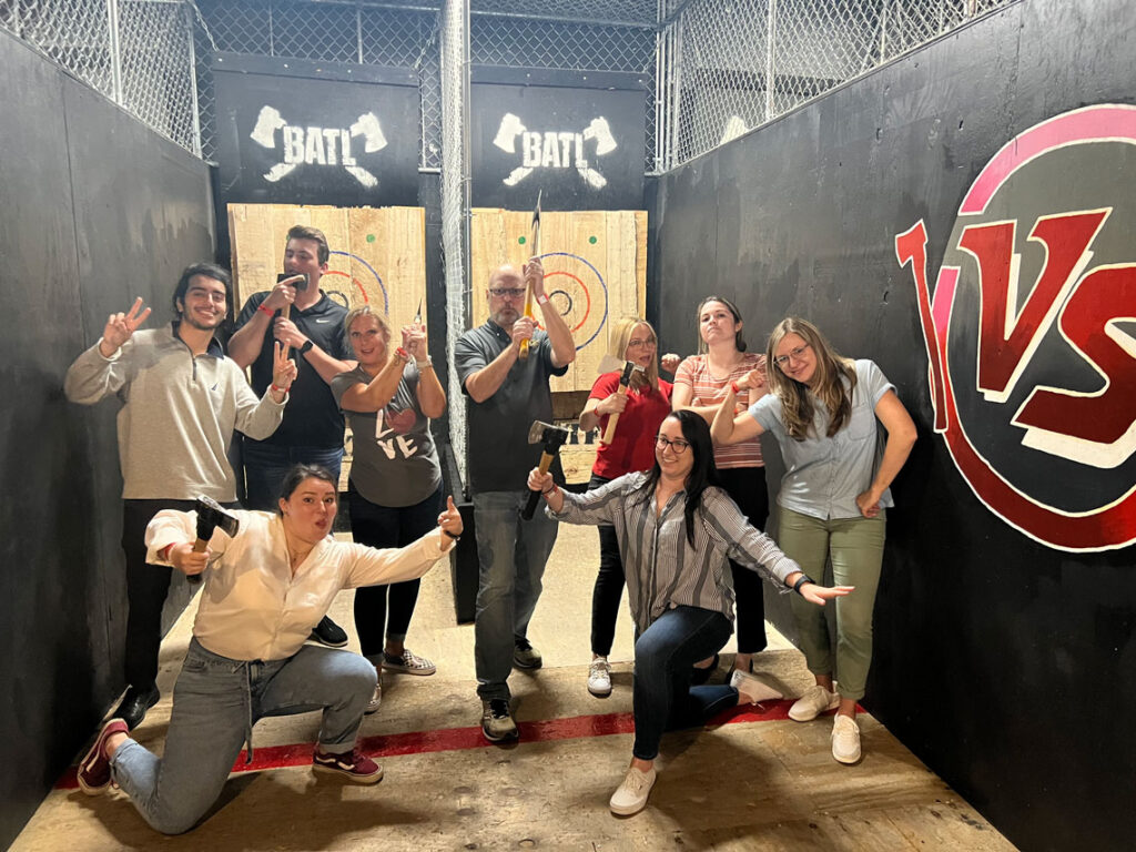 The Curley & Pynn team enjoys an axe-throwing competition