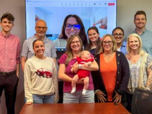 C&P Vice President Kacie Escobar joins the C&P team during her maternity leave to introduce newborn baby Olivia to the team (July 2025).