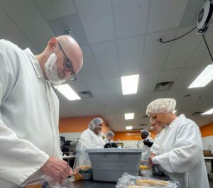 C&P’s Dan Ward and team preparing meals for the less fortunate during a volunteer event at Second Harvest food bank in Sept. 2025.
