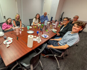 To commemorate our quarterly “rocks” (goals), the team painted literal rocks in the summer of 2025.